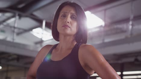 Portrait-Of-Mature-Woman-Wearing-Fitness-Clothing-Standing-In-Gym-Ready-To-Exercise